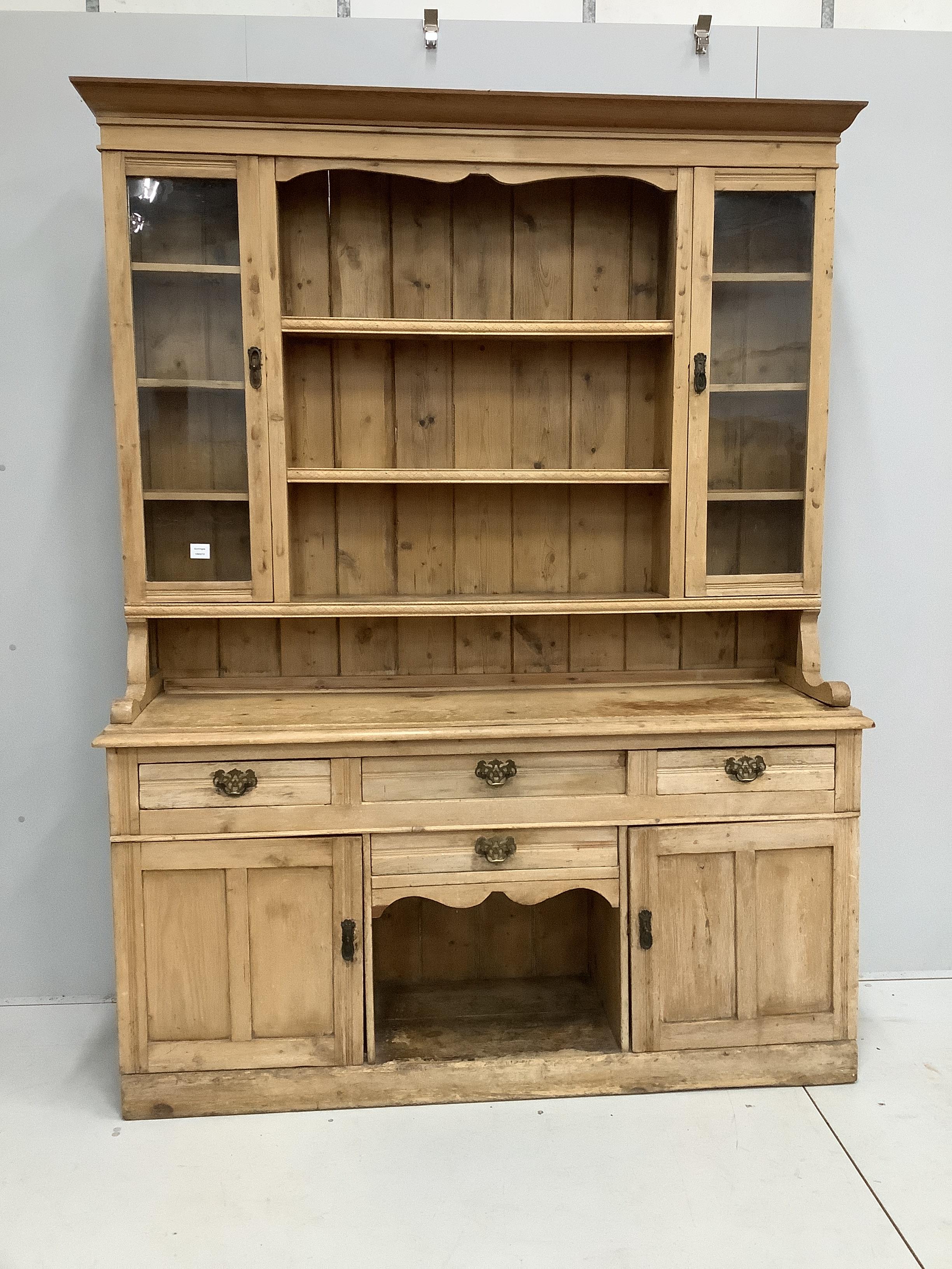 A late Victorian pine dresser, width 160cm, depth 45cm, height 211cm